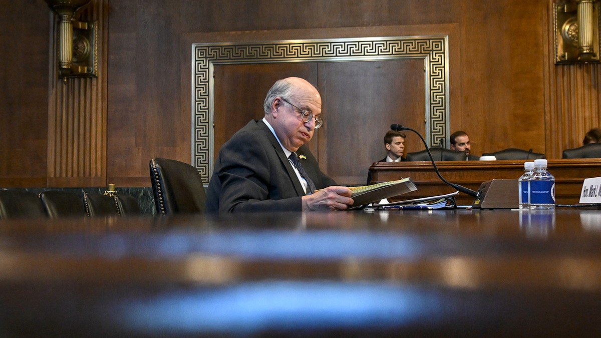 Senior Judge Mark L. Wolf listens attentively during a Senate Judiciary subcommittee hearing on federal judicial ethics in Washington, D.C.