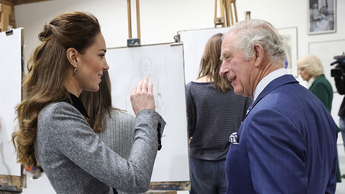 Kate Middleton chatting with King Charles at a royal engagement.