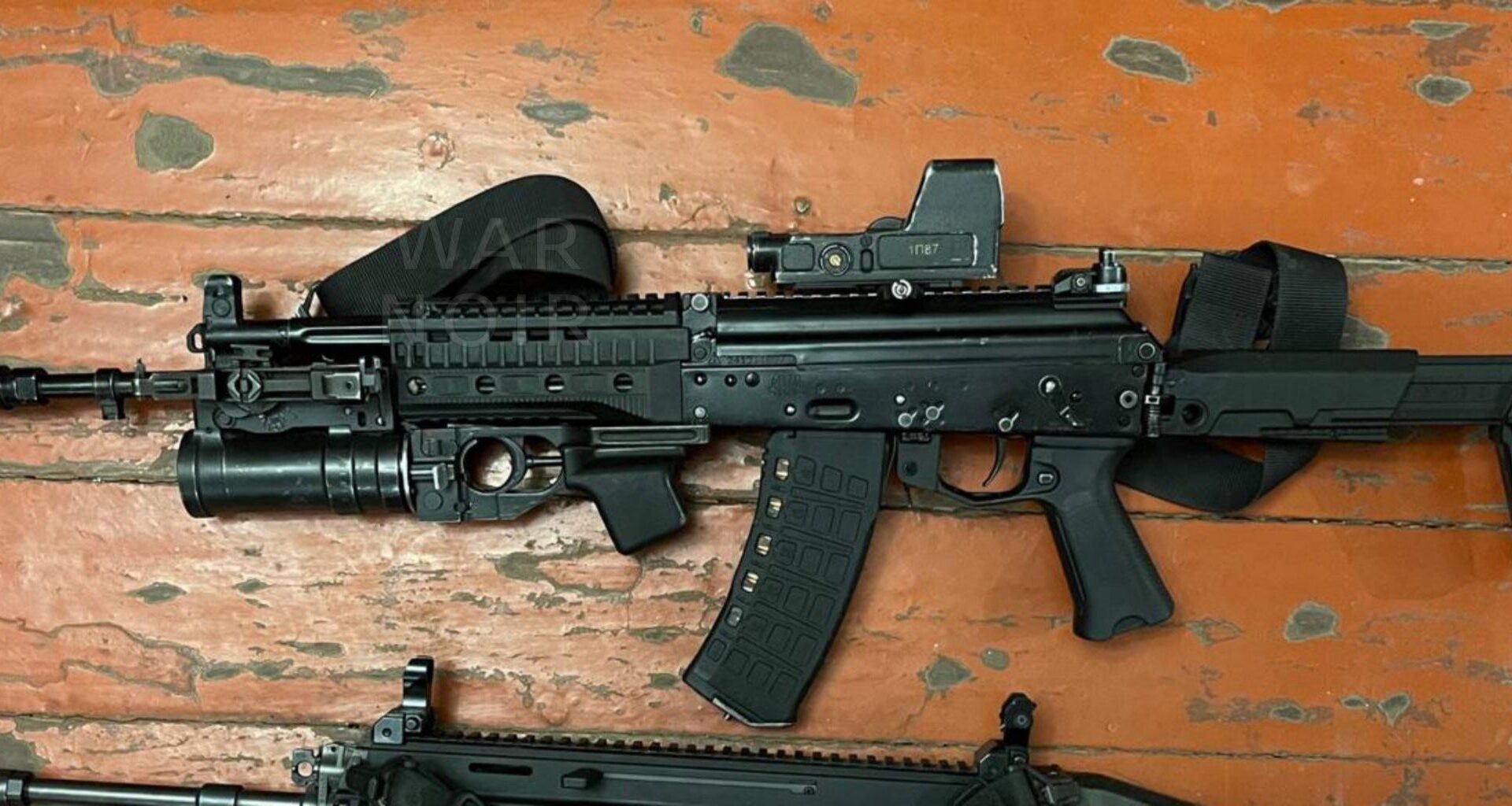 Ukrainian soldier took a photo of a captured Russian AK-12 Obr. 2023 assault rifle, it was produced in 2024, it’s equipped with an 1P87 optical sight and a GP-25 grenade launcher.