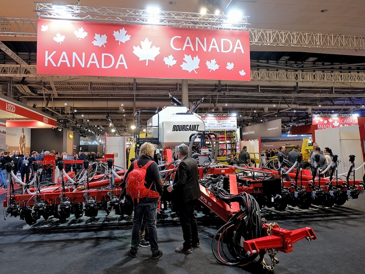 farm equipment on display at an indoor pavilion