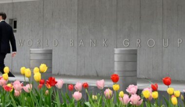 A person walks past the World Bank building in Washington, DC, on April 21, 2022. (AFP Photo)
