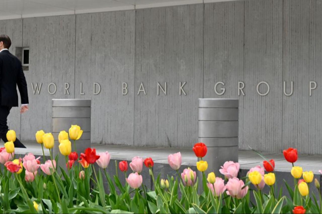 A person walks past the World Bank building in Washington, DC, on April 21, 2022. (AFP Photo)