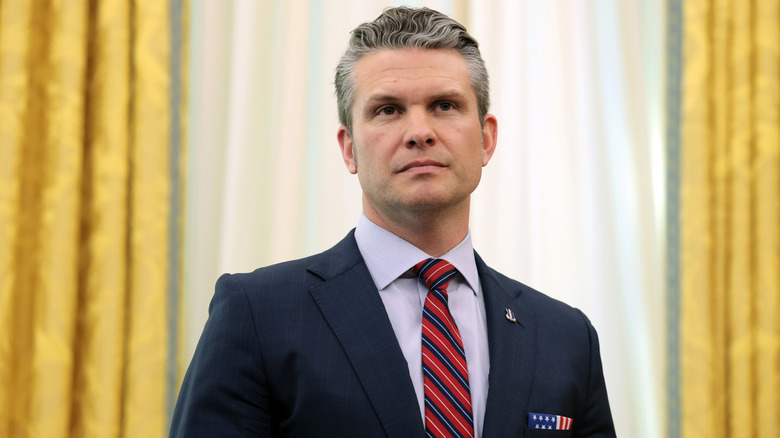 U.S. Secretary of Defense Peter Hegseth listens as U.S. President Donald Trump delivers remarks in the Oval Office of the White House on March 21, 2025 in Washington, DC.
