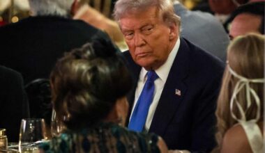 US President Donald Trump talks with guests during a Halloween party at his Mar-a-Lago estate on October 31, 2025 at Palm Beach, Florida.