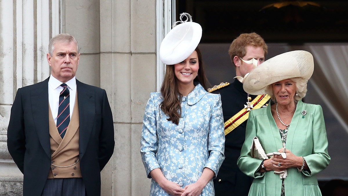 Prince Andrew standing far away from Kate Middleton and Queen Camilla.