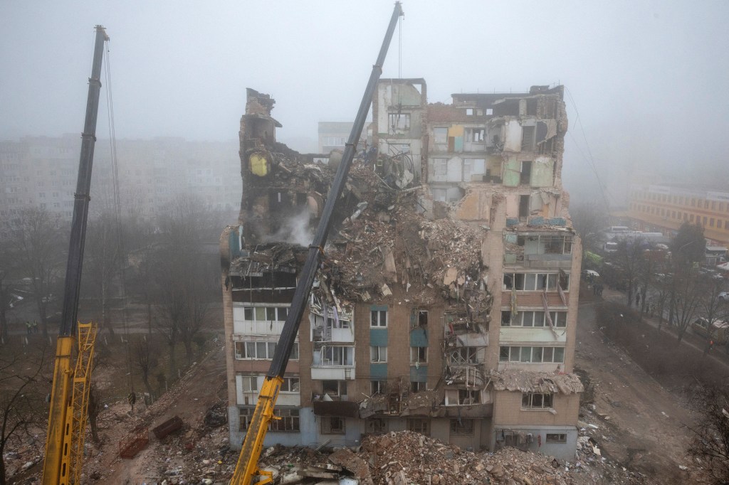 Rescuers clear debris from an apartment building hit by a Russian missile in Ternopil, Ukraine.