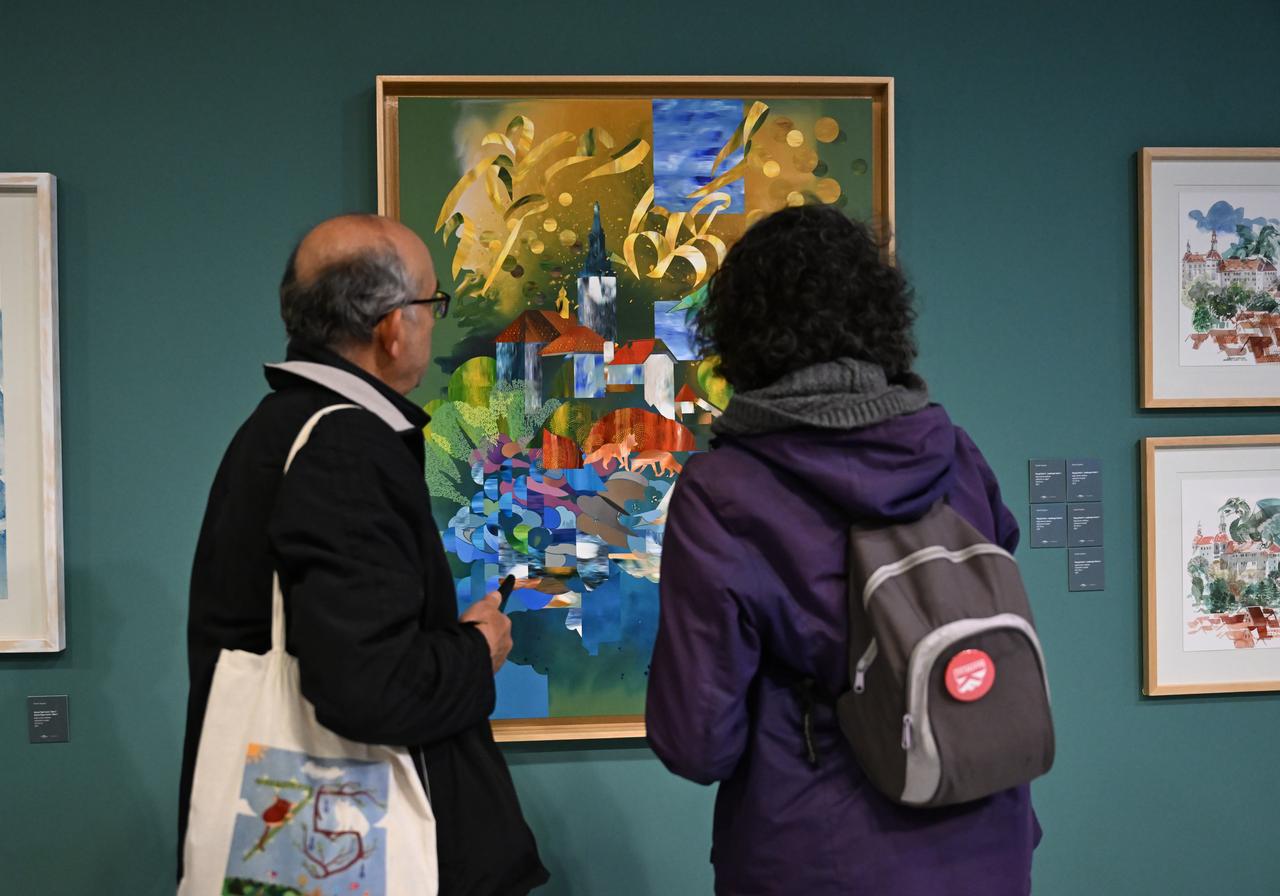 Visitors view a colorful landscape painting during the Rewind/Slovenia exhibition at CerModern in Ankara, Türkiye, November 6, 2025. (AA Photo)