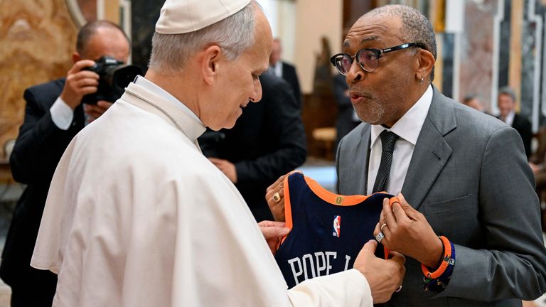 Spike Lee presents Pope Leo XIV with a New York Knicks basketball jersey at the Vatican. Pic: AP