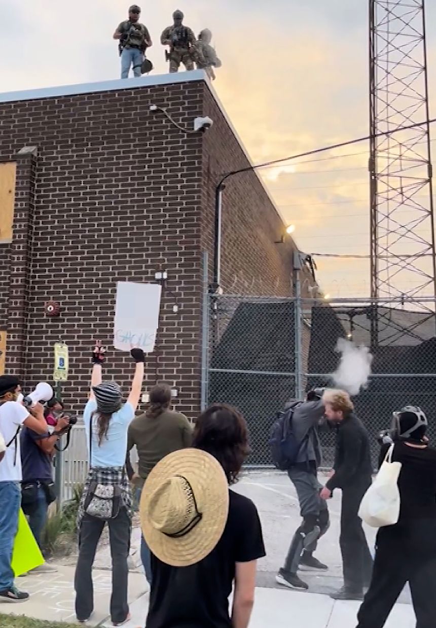 Rev. David Black is shot in the head with a pepper ball by ICE agents who were on the roof of the Broadview facility on September 19. A portion of this image has been obscured due to profanity.
