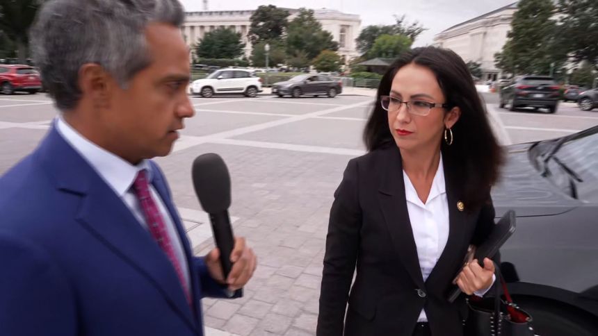Rep. Lauren Boebert, right, speaks with CNN's Manu Raju on Wednesday.