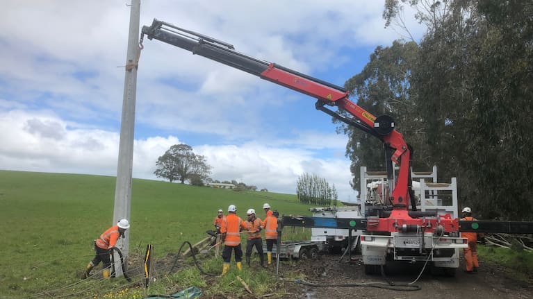 The team at working installing a new power pole in Ermedale, rural Southland.