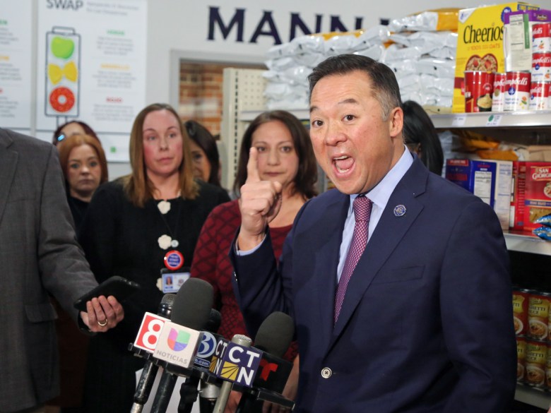 Man gestures while speaking