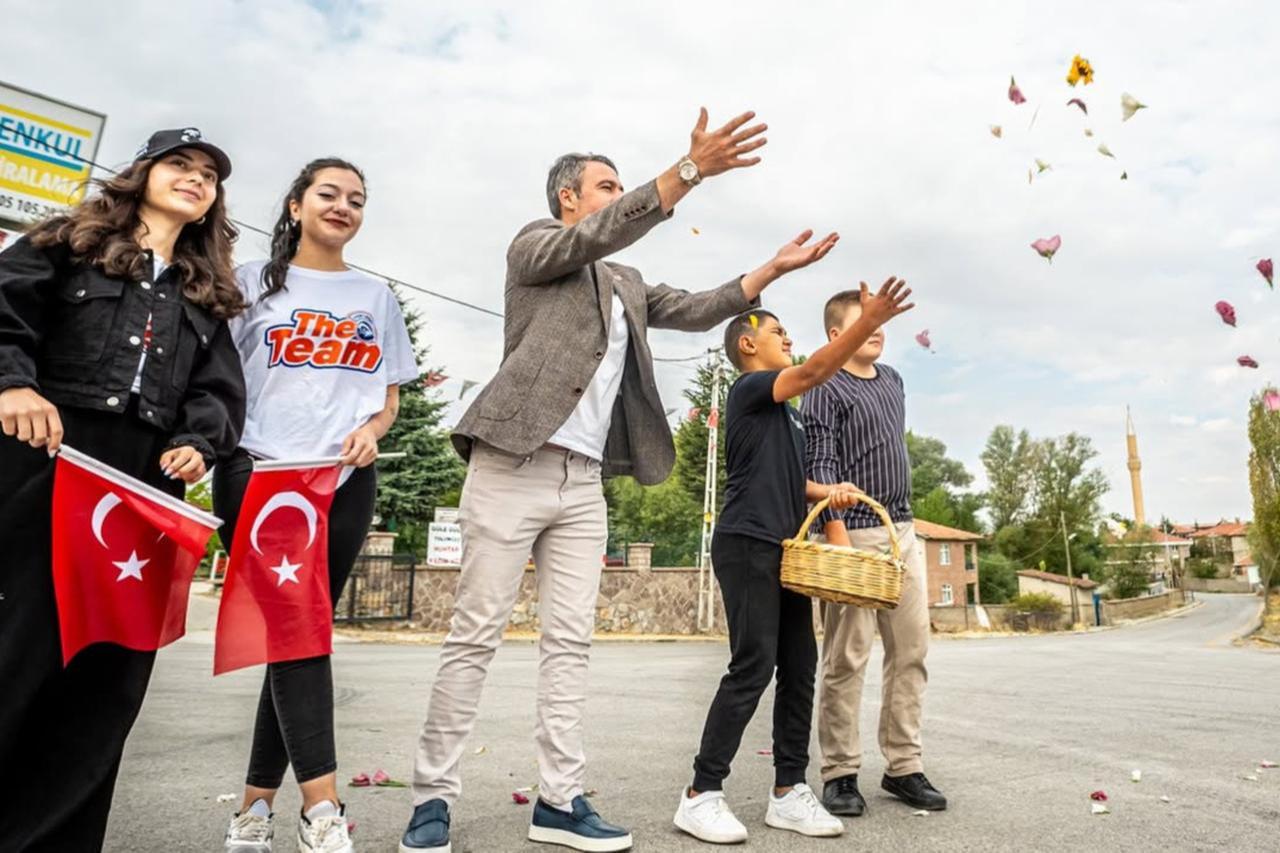Residents greet cyclists with flowers in Tulumtas Village during the 2024 Gran Fondo Baskent cycling race held in Ankara, Türkiye. (Photo via Gran Fondo Baskent's website)