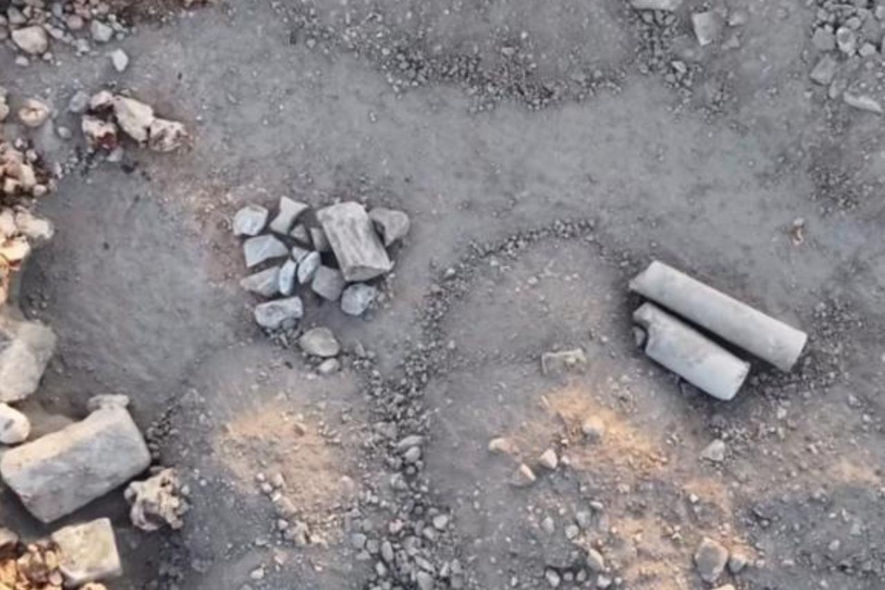 Broken column shafts and architectural stone fragments are seen dumped and scattered in the spoil area near the construction site in Silifke’s archaeological zone, Mersin, Türkiye. (Photo via Instagram/@silifkehaberajansi)