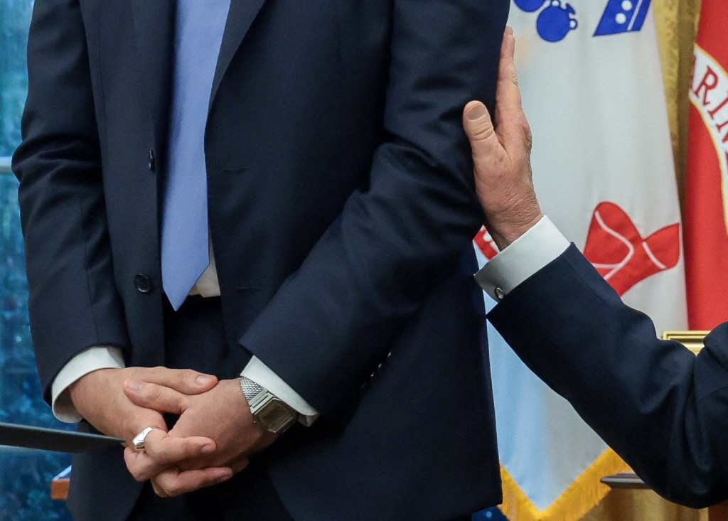 President Trump touches New York City Mayor-elect Mamdani's arm.