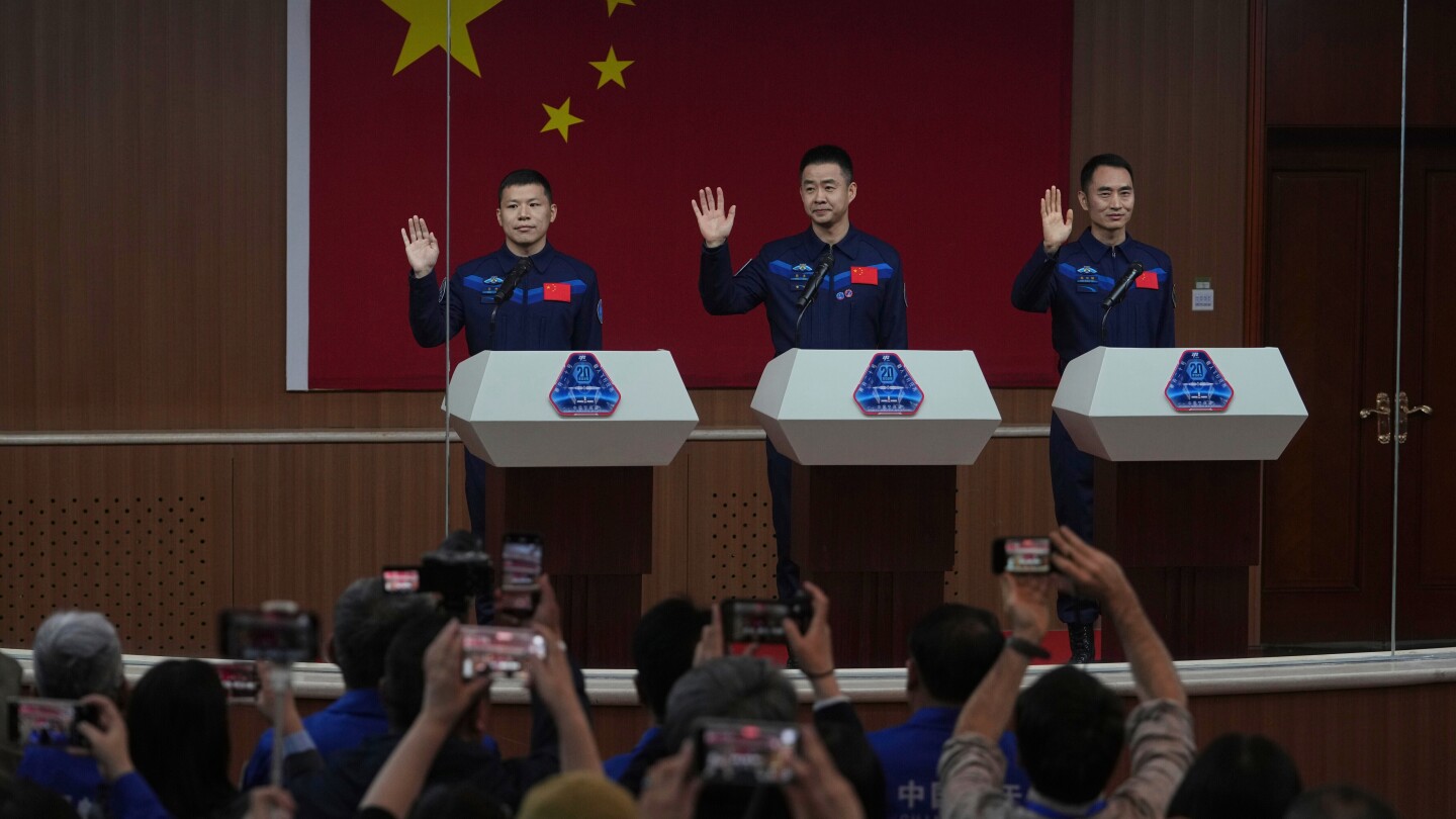 China's stranded astronauts return from space station