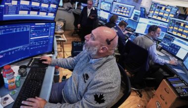 Big swings keep rocking Wall Street as S&P 500 veers from a nearly 2% jump to a 1% drop