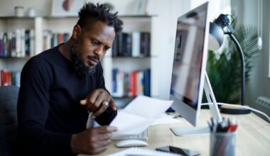 A person in an office looks at a document.