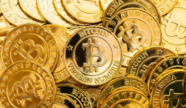 Gold coins with Bitcoin logo on them.