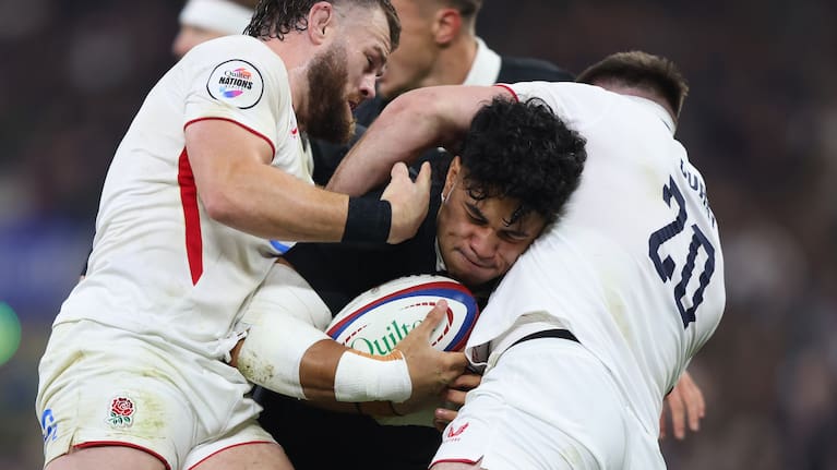 Wallace Sititi is well wrapped up by the English defence at Twickenham.