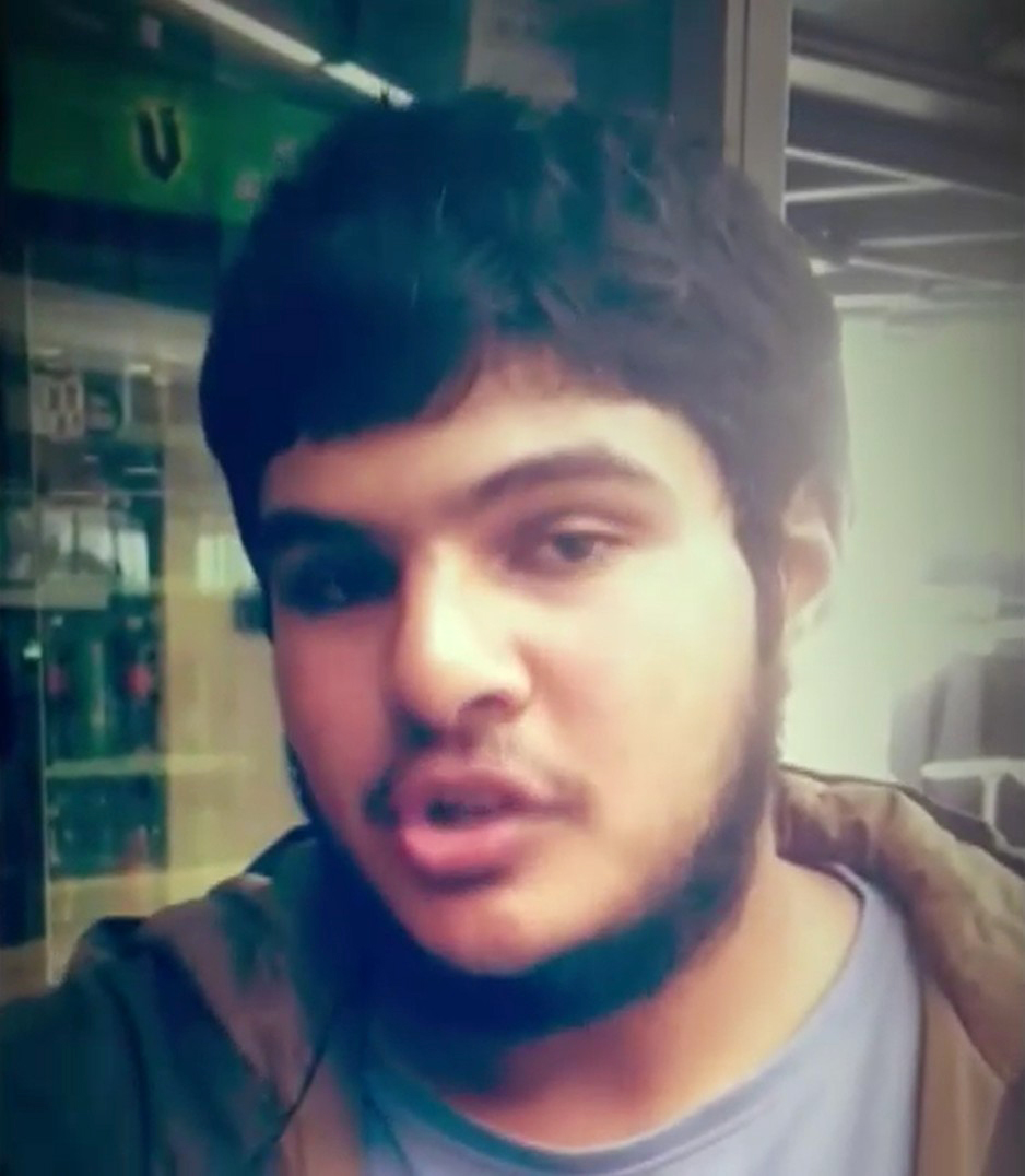 Video still of Naveed Akram speaking.