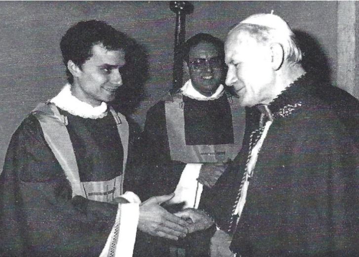 Pope John Paul II shaking hands with a newly ordained Rev. Robert Prevost in 1982.