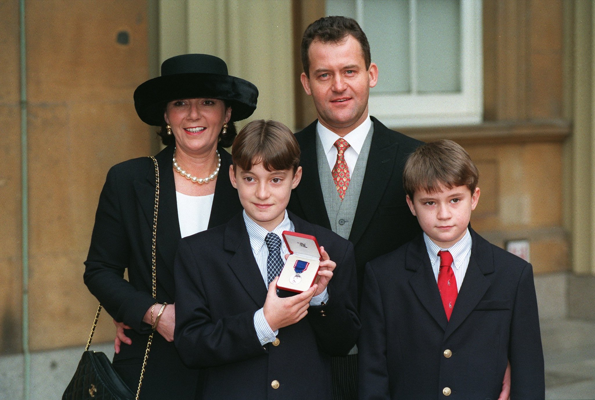 Paul Burrell, his wife Marie, and sons Alex and Nick, after Burrell received his Royal Victorian Medal.