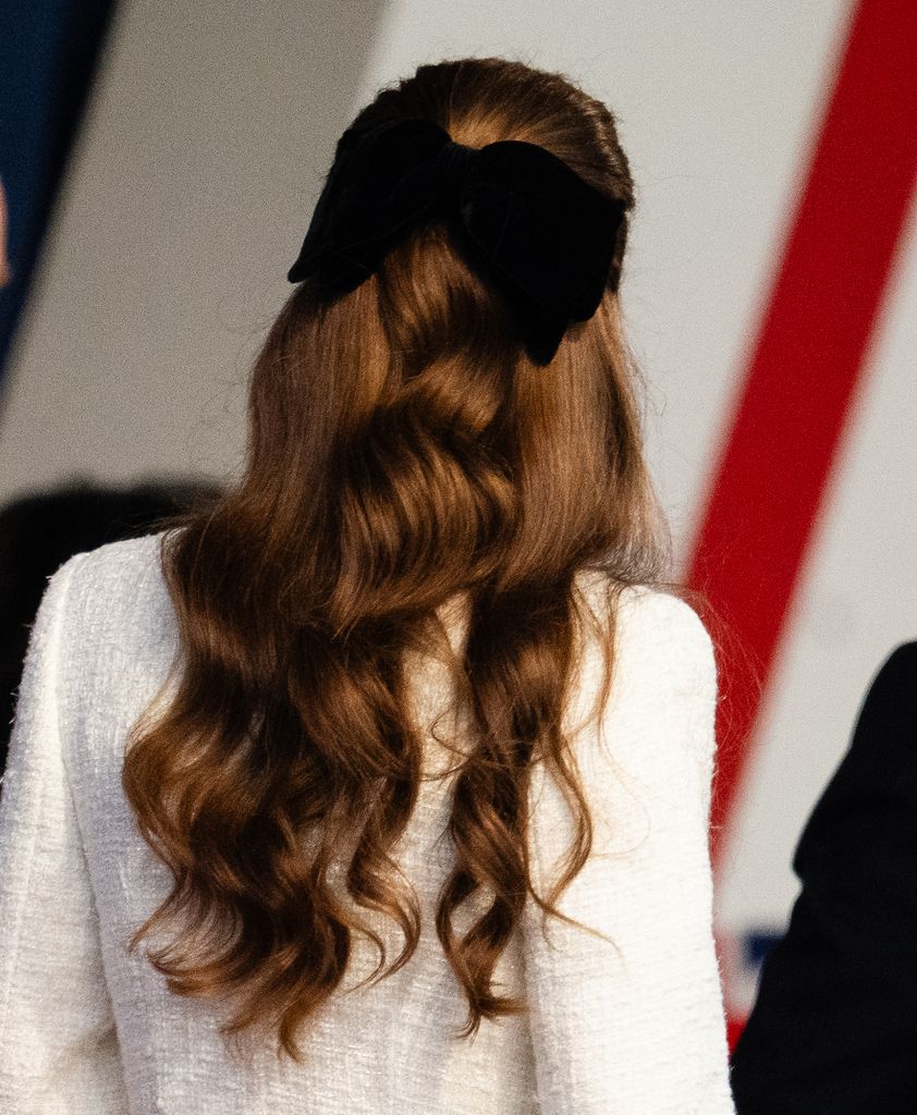 Kate from behind with bow in hair