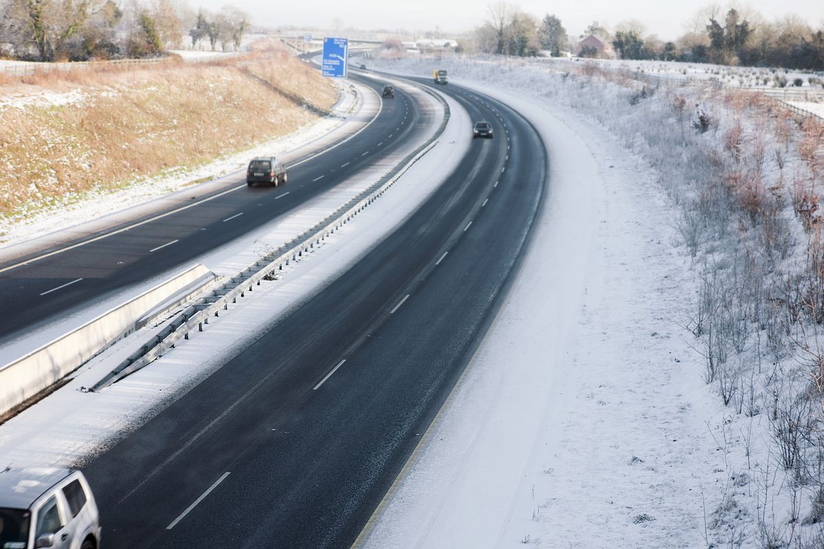Dual carriage way from above on a snowy winter daywith low light