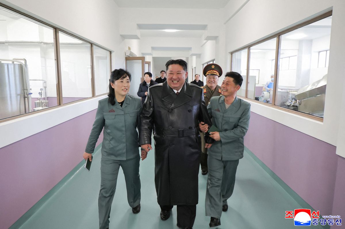 Jong-un walking with a group of people