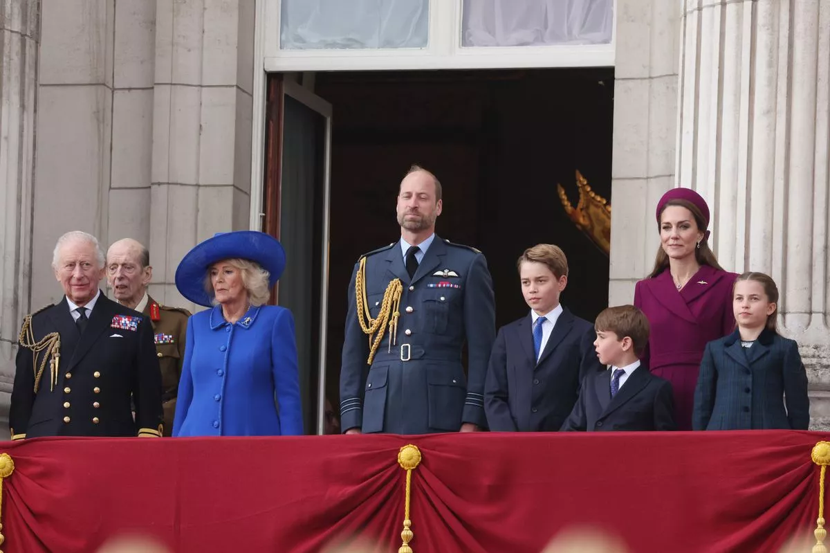 King Charles III, Queen Camilla, Prince William, Prince of Wales, Prince George, Prince Louis, Catherine, Princess of Wales and Princess Charlotte on the balcony of Buckingham Palace during the military procession to mark the 80th anniversary of VE Day on May 05, 2025 in London, England.
