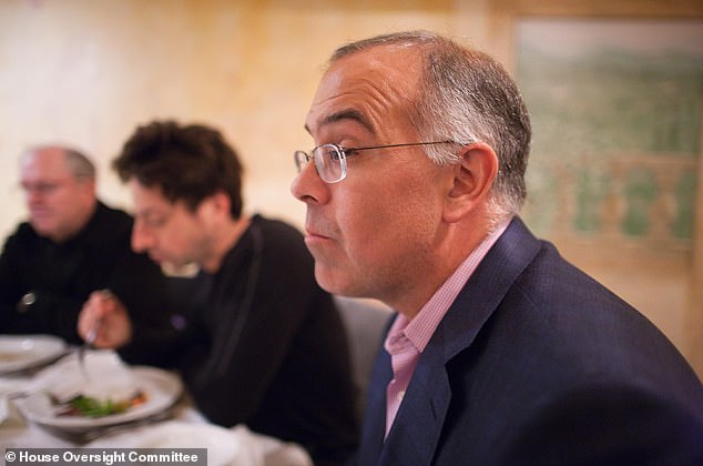 David Brooks (front, right) is pictured during the meal. He was apparently seated next to Sergey Brin (center, background)