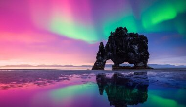 Each year, millions of travellers visit Iceland in the hope of catching a glimpse of the Northern Lights. The lights are pictured over Basalt stack Hvitserkur on the Vatnsnes peninsula, Iceland