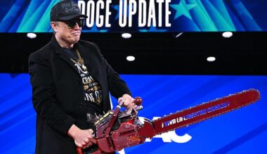 Elon Musk holds a chainsaw reading "Long live freedom, damn it" during the annual Conservative Political Action Conference (CPAC) at the Gaylord National Resort & Convention Center at National Harbor in Oxon Hill, Maryland, on February 20, 2025.