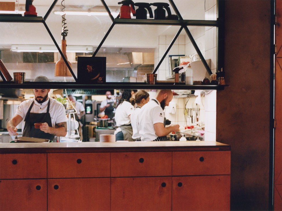 Chefs at work in the kitchen at Cosmos restaurant, Sofia