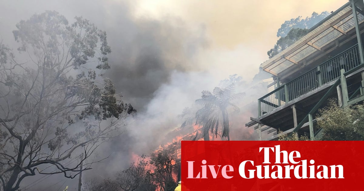NSW Central Coast ‘not out of the woods yet’ as bushfire conditions ease – as it happened | Australia news