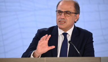 GettyImages 2147903311 showing a business meeting with diverse professionals discussing strategies in a modern conference ...