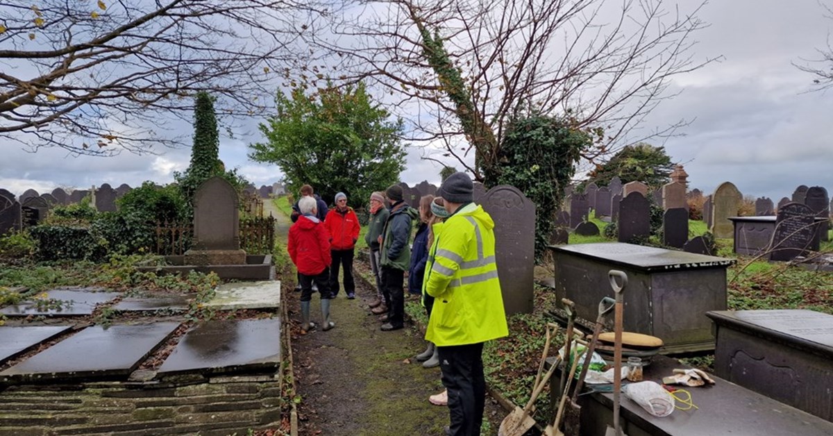 Refugees and asylum-seekers plant bluebells in Welsh churchyard to encourage friendship
