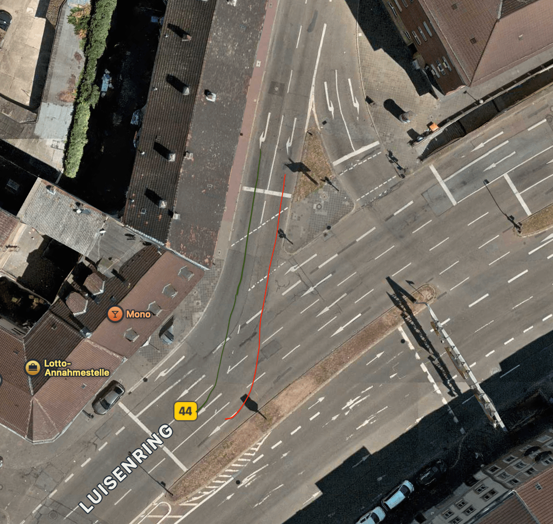 Accident due to changing lanes at a curved signal crossing.