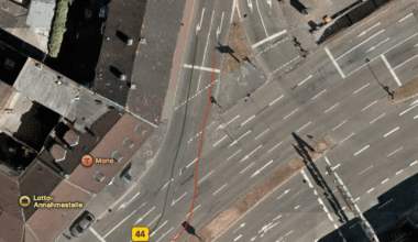 Accident due to changing lanes at a curved signal crossing.