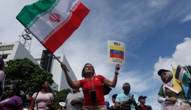 A Venezuelan woman waves an Iranian flag in Caracas