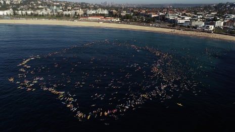 Hundreds return to waters of Bondi Beach in paddle-out tribute to victims of mass shooting – video