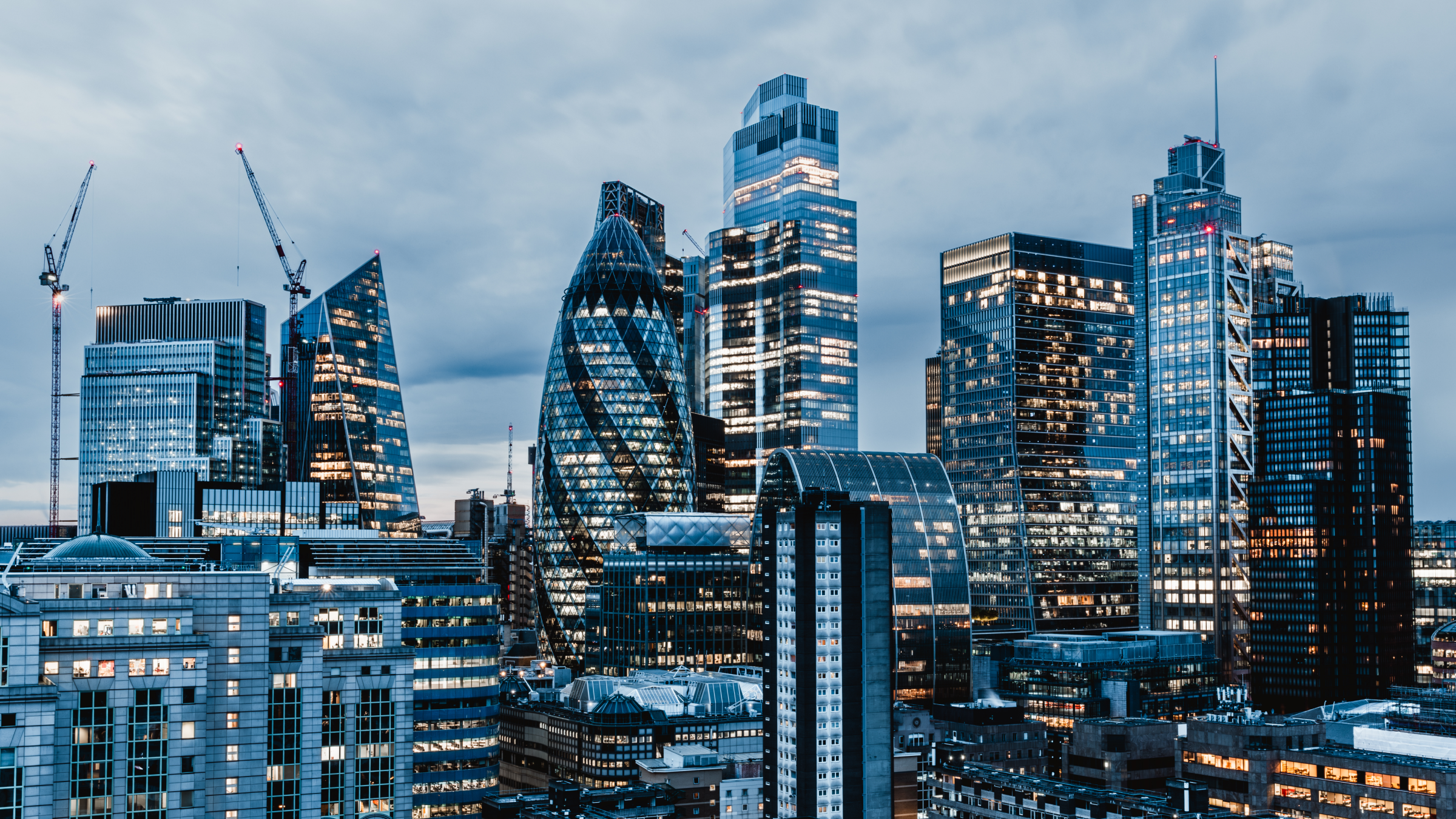 City of London illuminated skyline at dusk, high angle view, England, UK