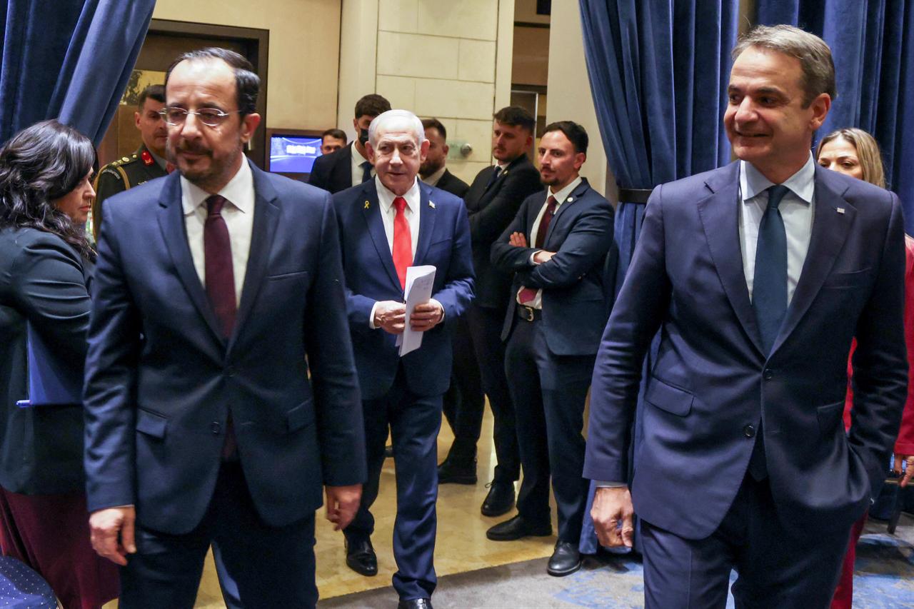 Cyprus President Nikos Christodoulides (L), Israels Prime Minister Benjamin Netanyahu (C) and Greek Prime Minister Kyriakos Mitsotakis (R) walking ahead of a trilateral summit in Jerusalem, Israel on Dec. 22, 2025. (Cypruss Press and Information Office/AFP Photo)