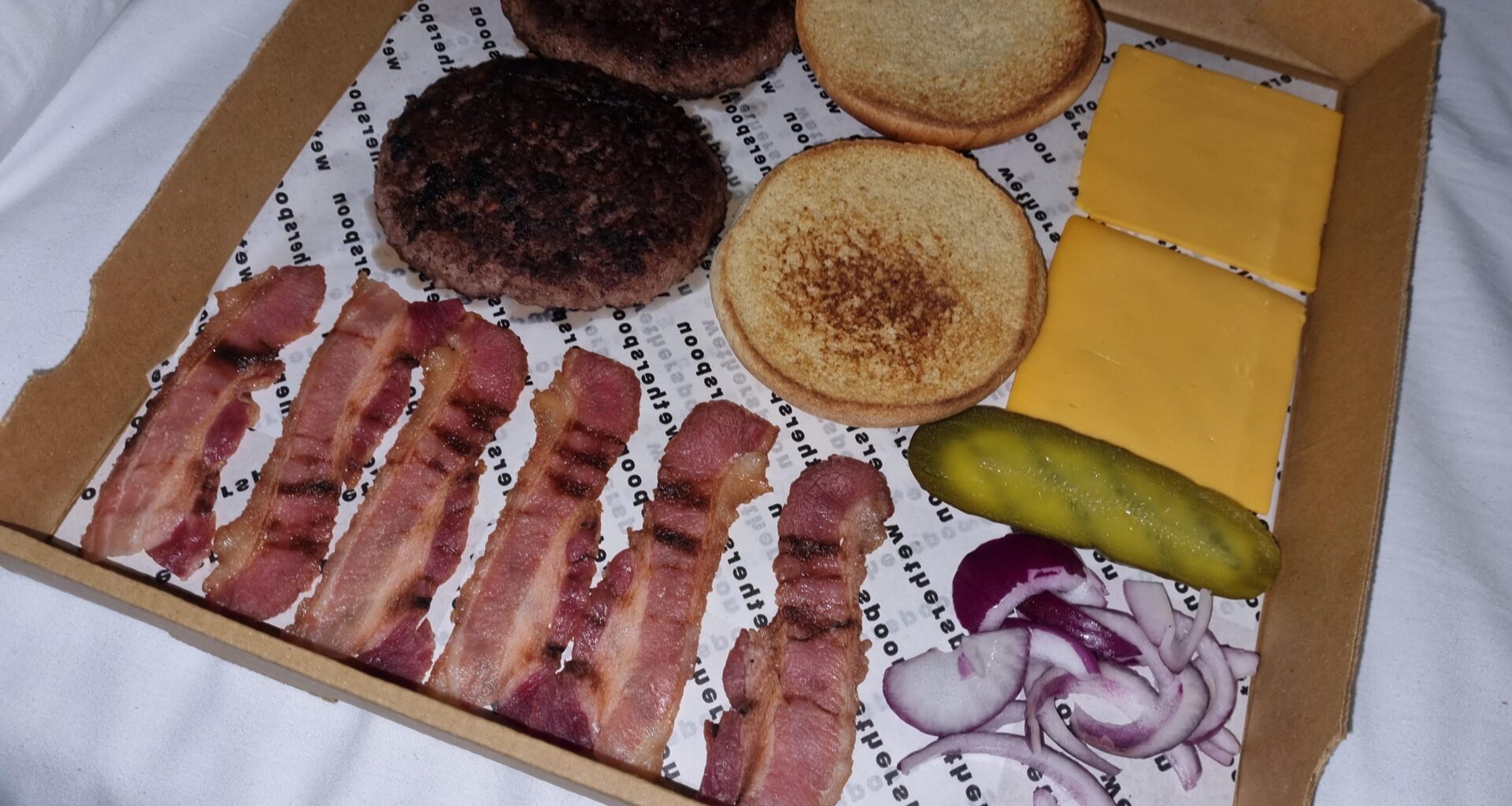 Local spoons ran out of takeout boxes so they neatly flat packed my burger in a pizza box