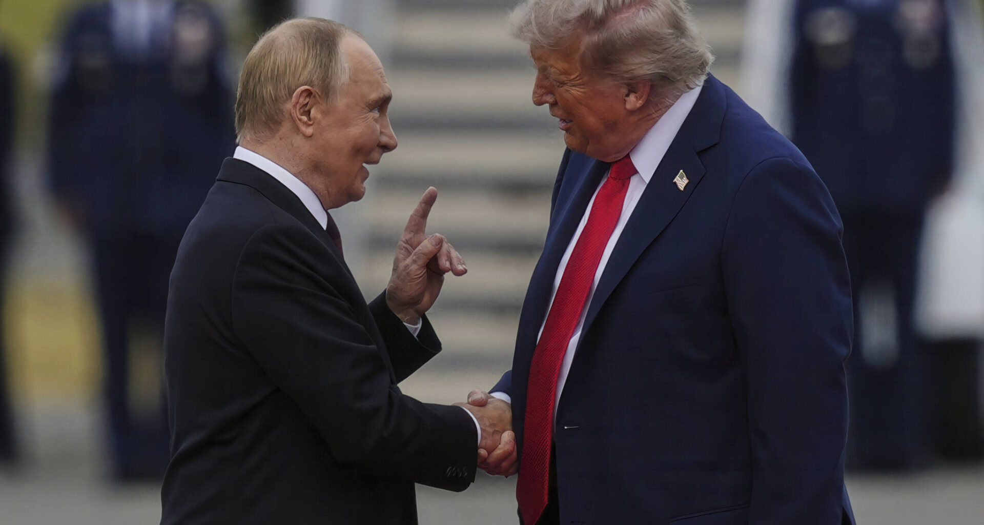 U.S. President Donald Trump greets Russia&rsquo;s President Vladimir Putin in August at Joint Base Elmendorf-Richardson, Alaska. (Julia Demaree Nikhinson / The Associated Press files)