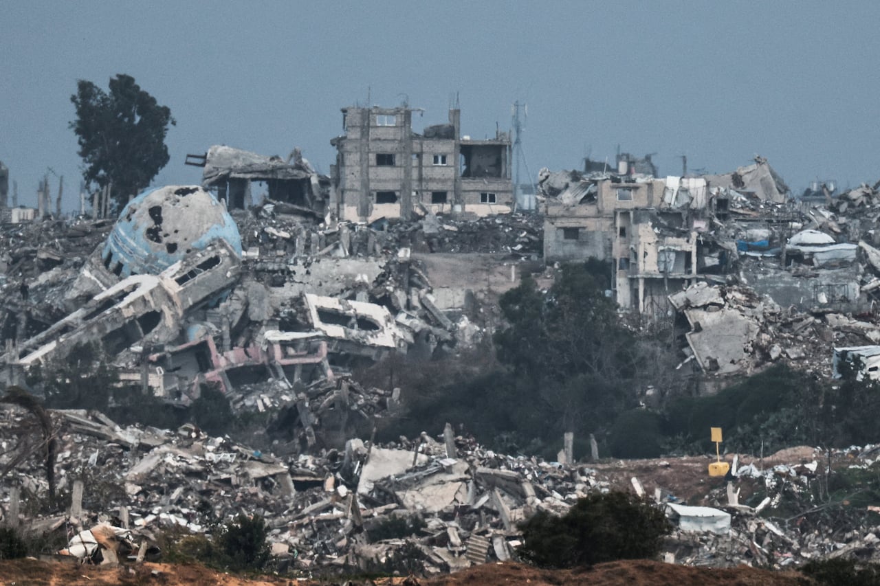 Wide shot of destroyed buildings and rubble