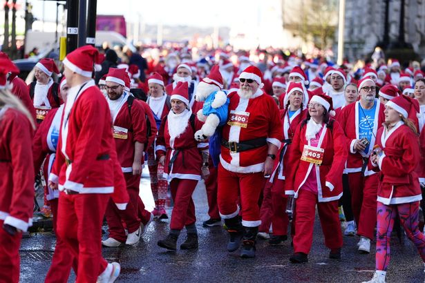 More than 8,000 participants, known as Santas, took part in the annual charity fundraising Liverpool Santa Dash event