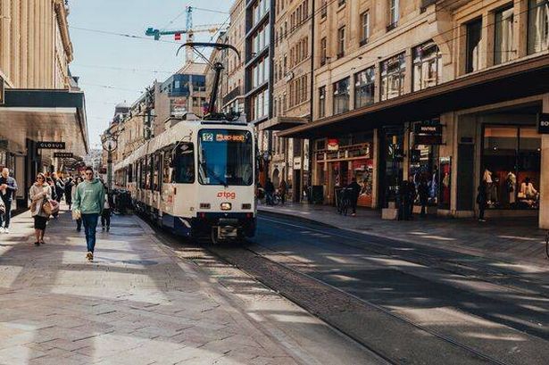 Photo of Geneva, Switzerland. Photo of the street. Old Town and City Traffic, picture with tram.