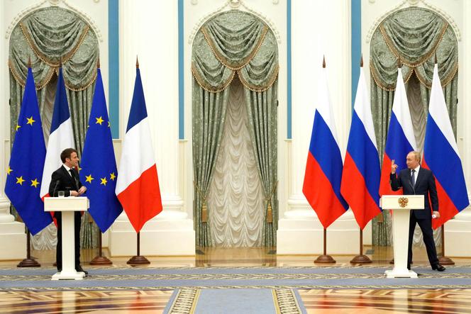 Russia's President Vladimir Putin (R) gestures during a joint press conference with France's President Emmanuel Macron in Moscow, on February 7, 2022.